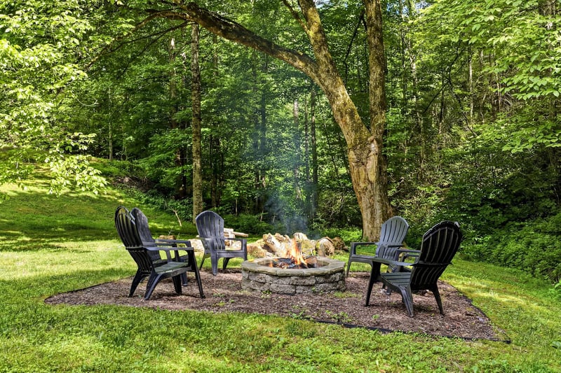 Gather around the stone fire pit surrounded by forest views, perfect for evening smores and storytelling under the trees.