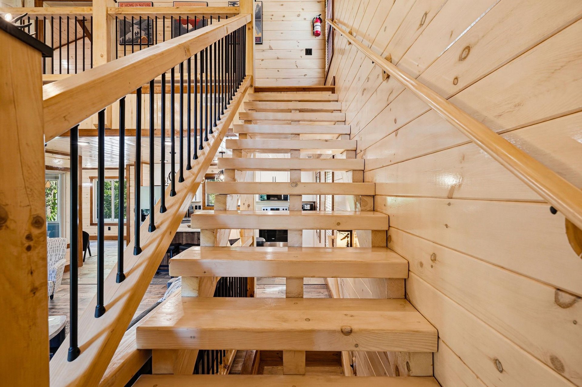 Warm wood tones and clean lines guide your way through this inviting multilevel retreat, where modern design meets mountain charm.