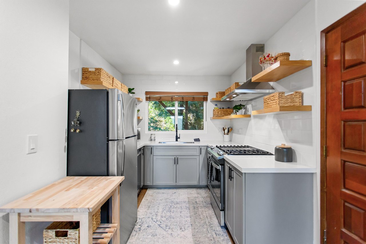 Stainlesssteel appliances, cooking essentials, and easy access to the dining area.