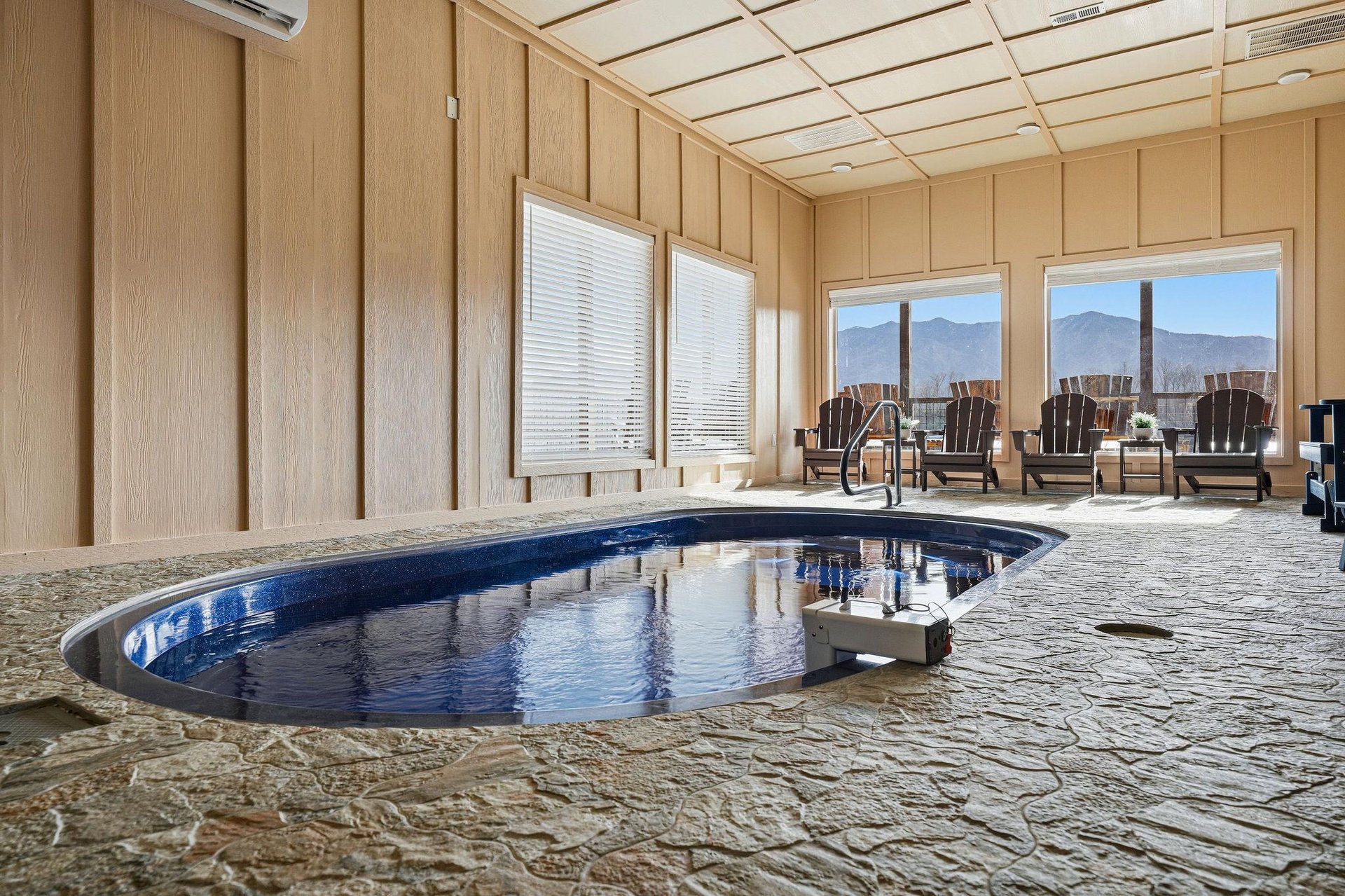 Soak in your private indoor hot tub while gazing at stunning mountain vistas through expansive windows.
