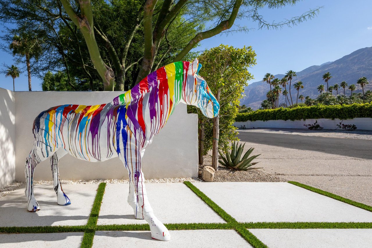 Colorful zebra sculpture near front gate ready to welcome guests.