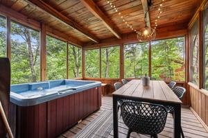 hot tub access with outdoor dining on entry level back porch