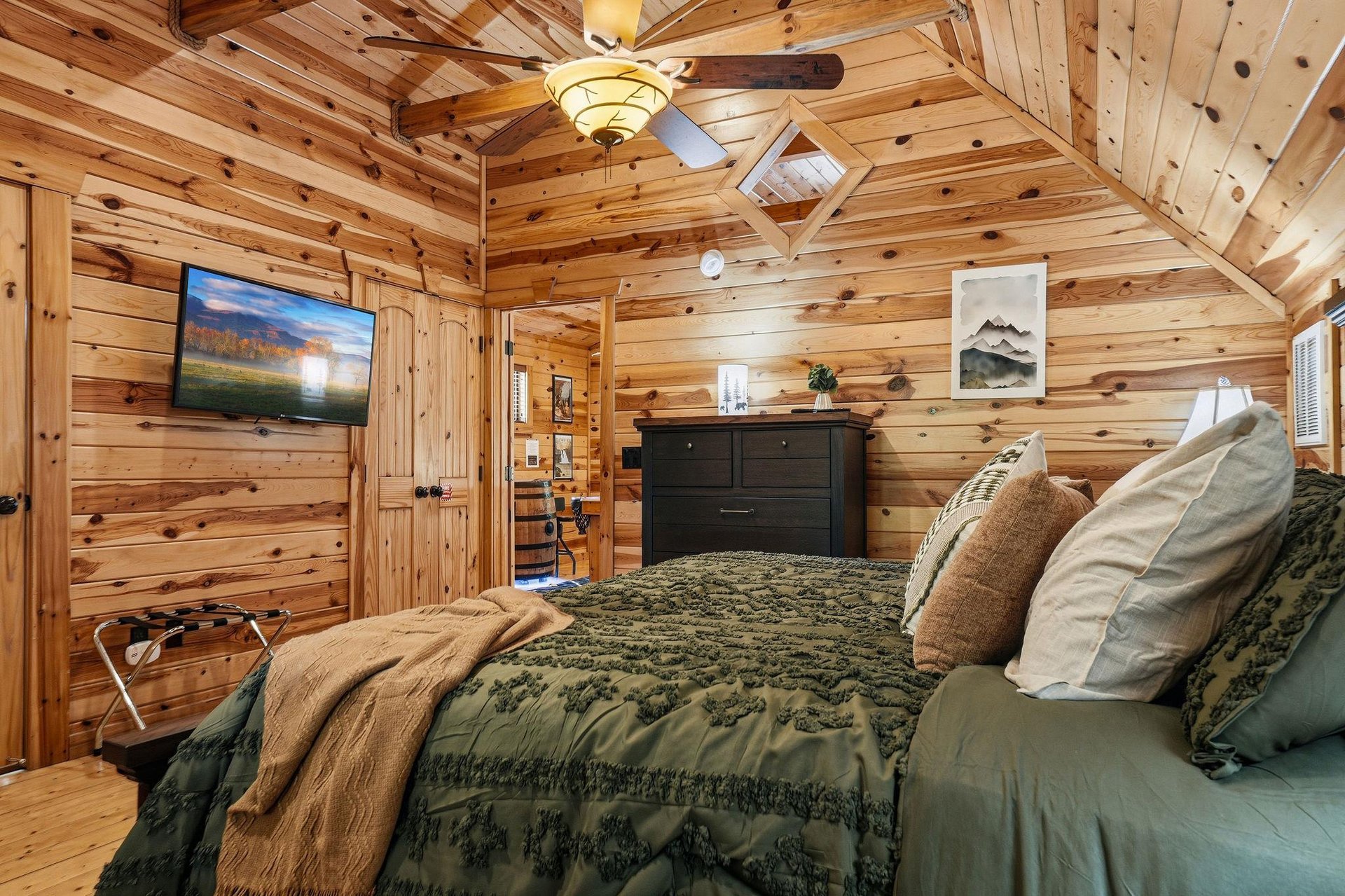 Drift off to sleep in your cozy log cabin bedroom, surrounded by warm wood and rustic charm.