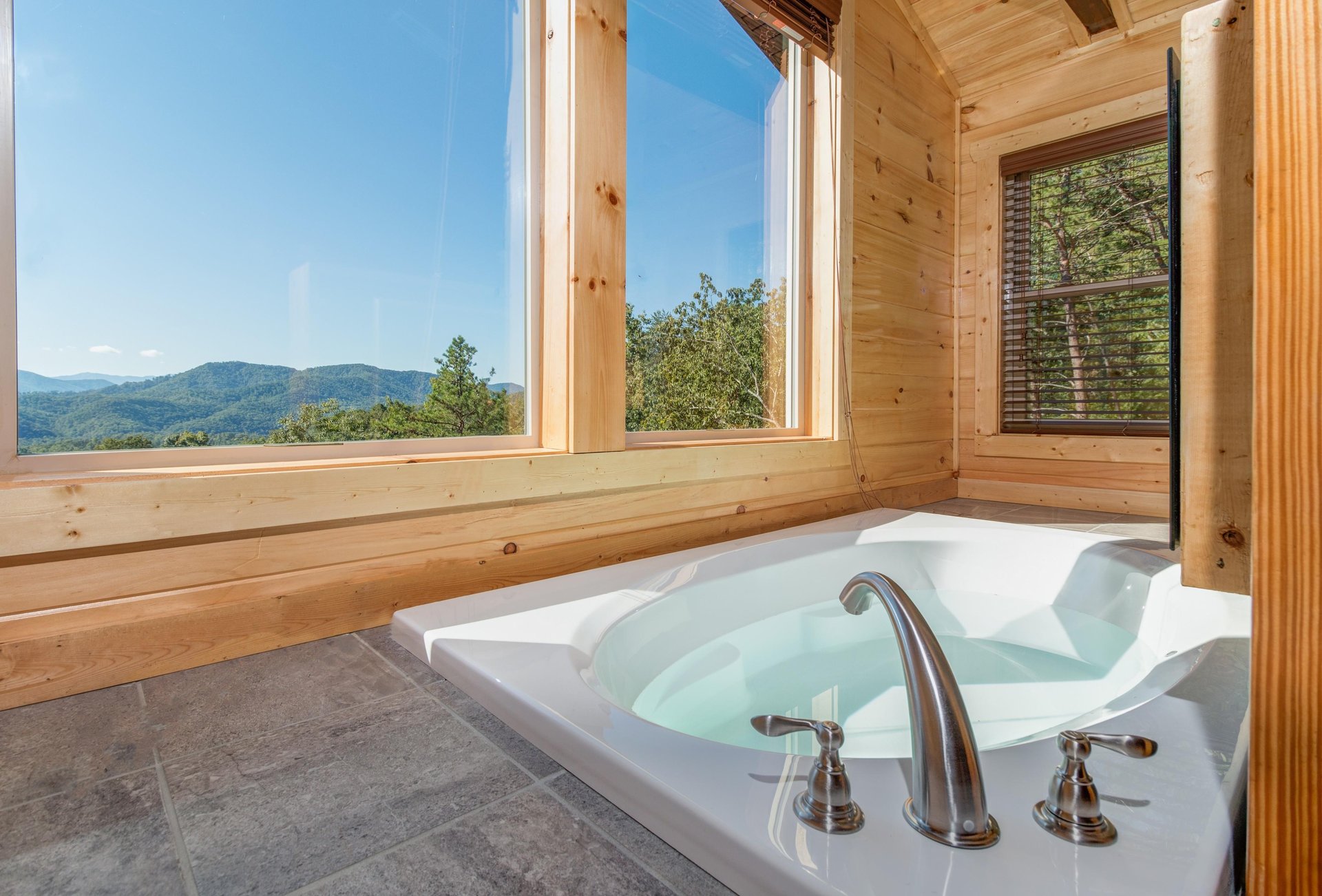 Jacuzzi in a bedroom at Canyon Camp Falls, a 2 bedroom cabin rental located in Pigeon Forge