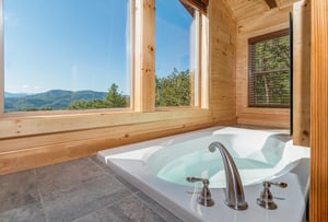 Jacuzzi in a bedroom at Canyon Camp Falls, a 2 bedroom cabin rental located in Pigeon Forge