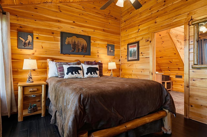 Sink into warm pine walls and cozy up under rustic decor in your private bedroom retreat, where comfort meets mountain charm.