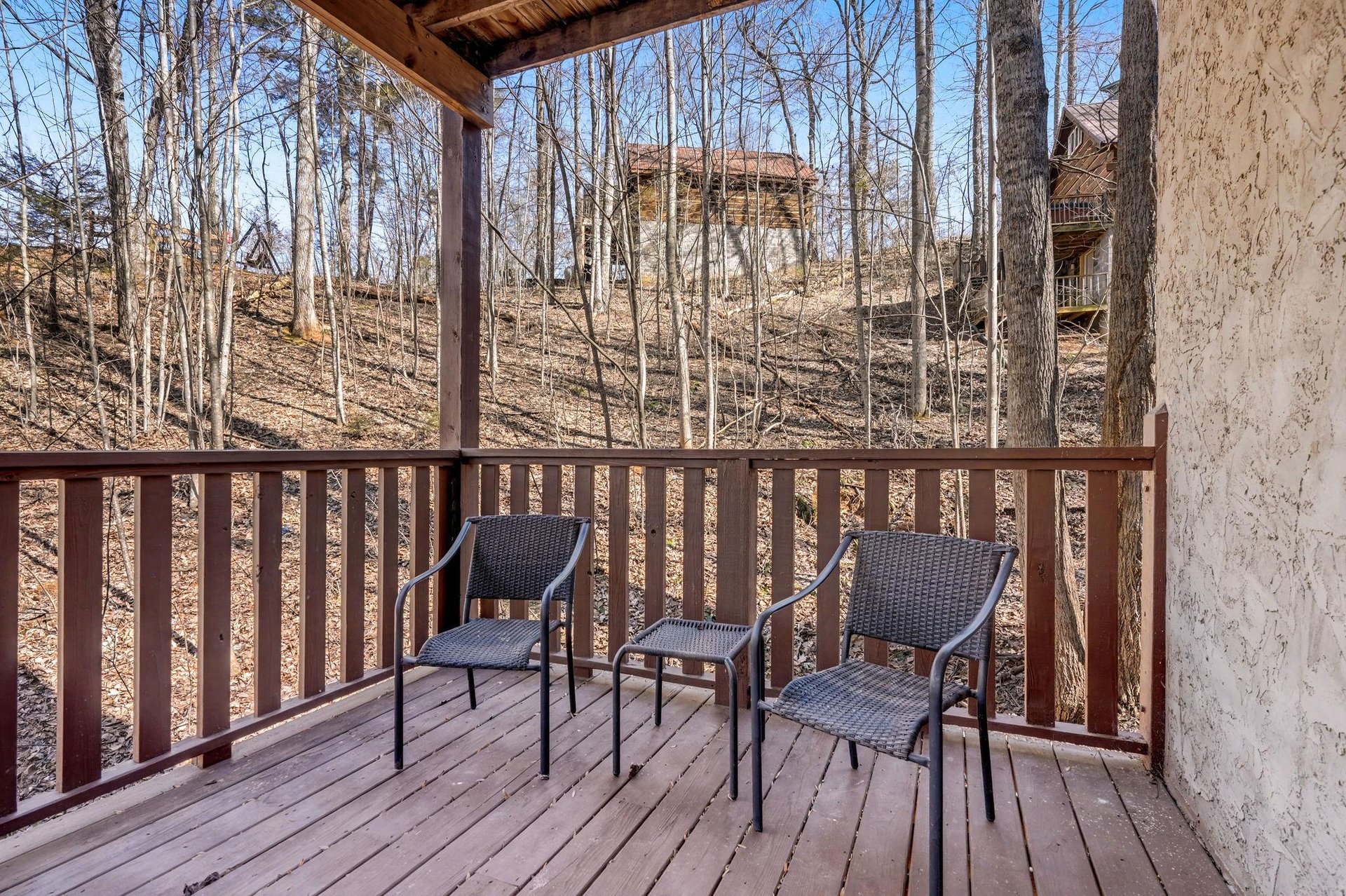 Step onto your private deck and unwind in comfortable seating while enjoying peaceful wooded views.