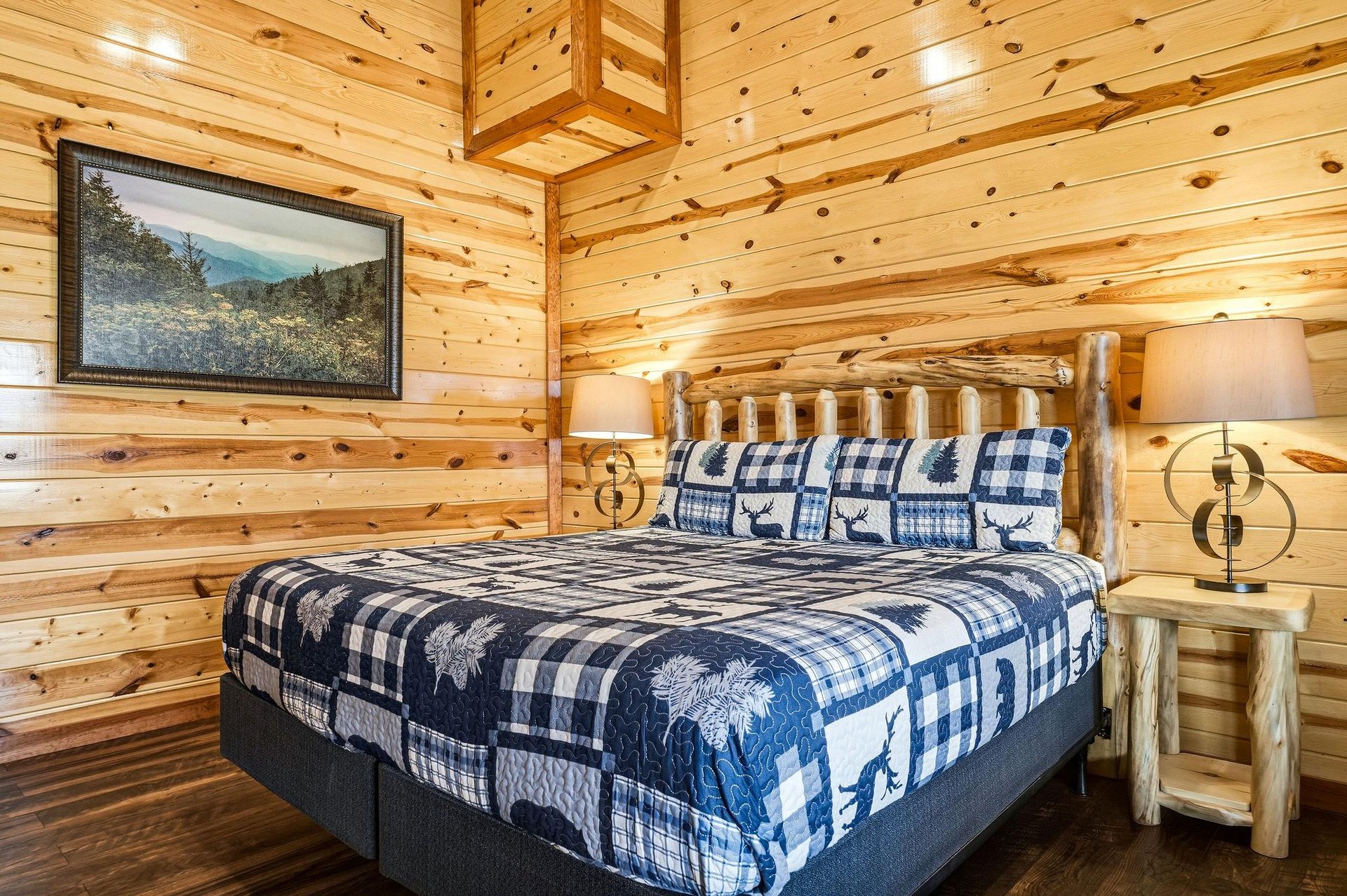 Cozy log cabin bedroom where youll drift off surrounded by rustic charm and woodlandthemed bedding.