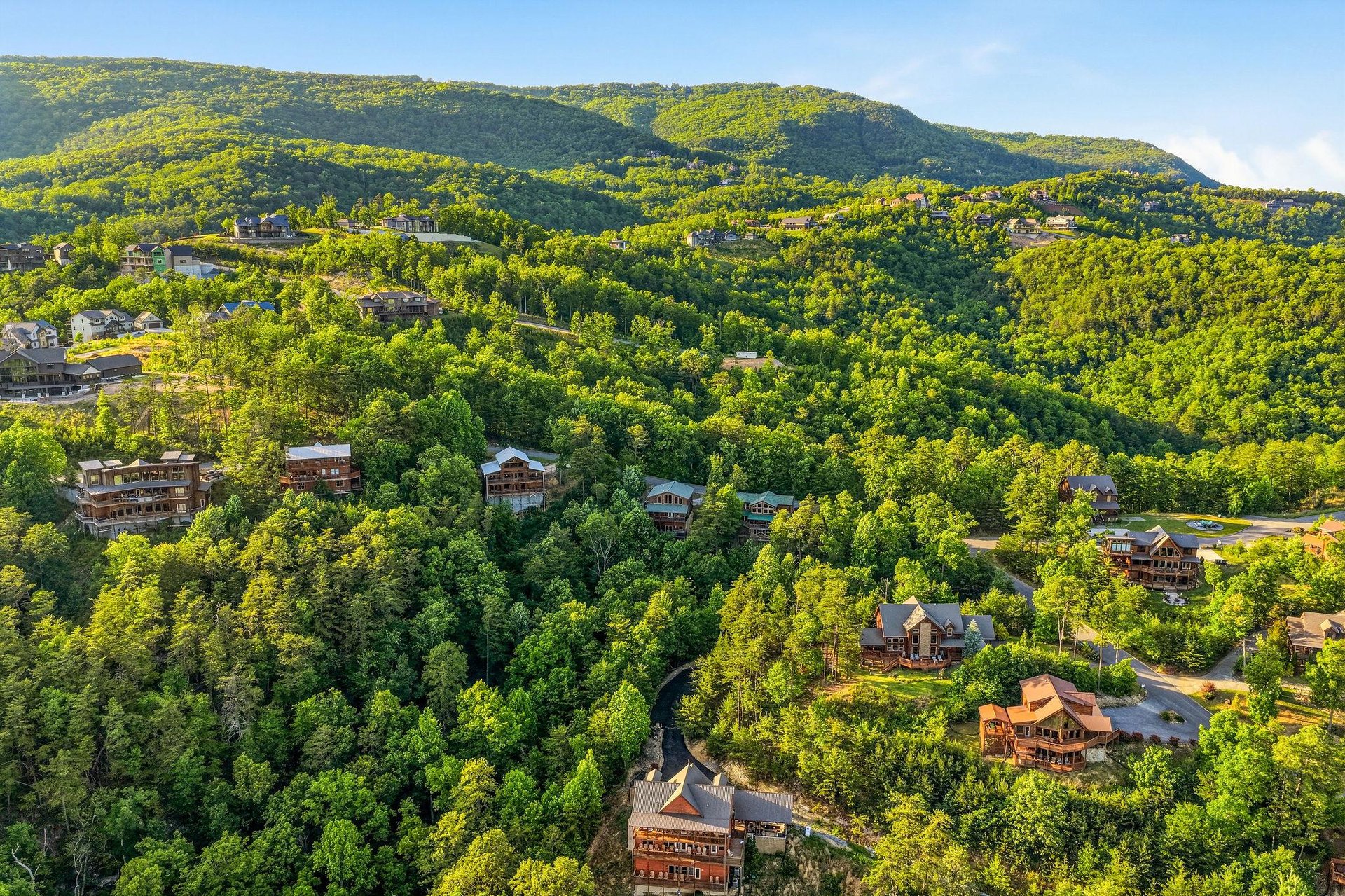 Nestled in lush green mountains, this scenic hillside community offers a tranquil retreat surrounded by natural beauty and forest views.