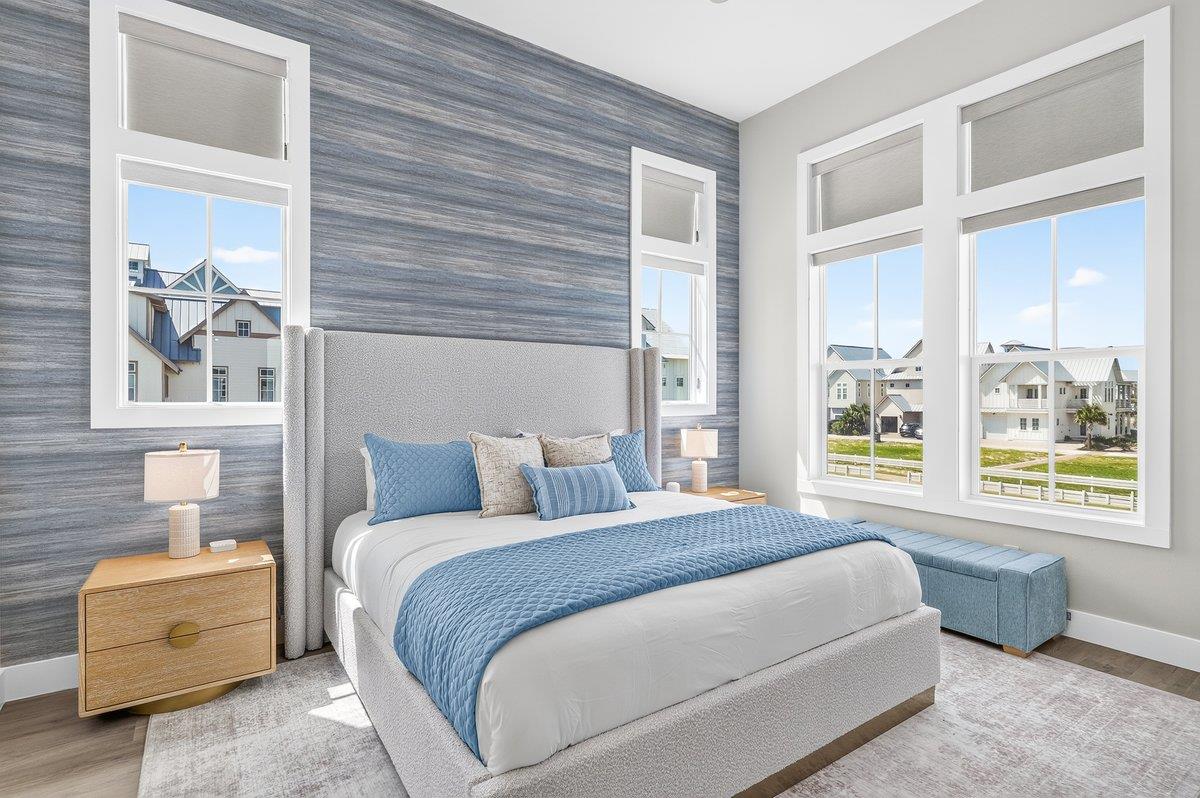 Retreat to the luxurious secondfloor primary king suite, thoughtfully designed for ultimate comfort and relaxation. This elegant sanctuary features a plush kingsize bed, sophisticated furnishings, a