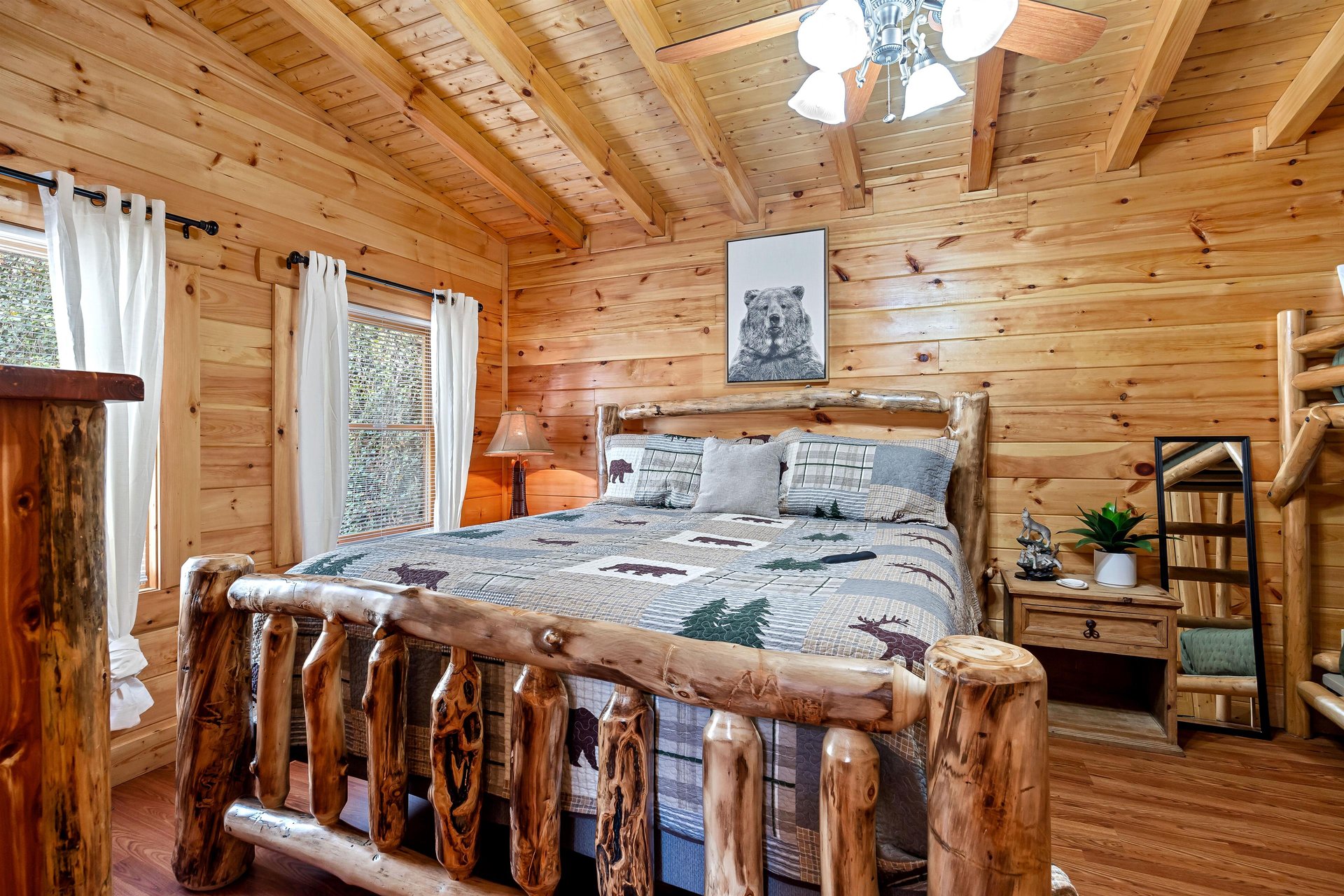 King bed beside windows