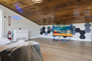 Challenge your friends to a friendly match in your private game loft, complete with retro arcade vibes, cozy seating, and all the entertainment you need for unforgettable evenings.