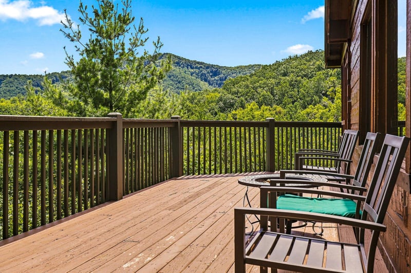 Nestle into your private deck and breathe in the sweeping mountain views—lush valleys, rolling hills, and endless sky create your peaceful escape.