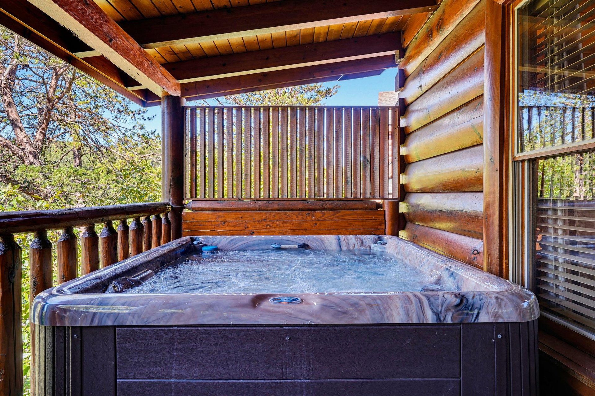 Slip into your private hot tub on the sheltered deck and let the warm bubbles melt away your cares while surrounded by mountain forest views.