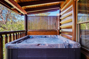 Slip into your private hot tub on the sheltered deck and let the warm bubbles melt away your cares while surrounded by mountain forest views.