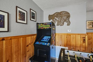 Challenge your friends to classic arcade games and foosball matches in this entertaining game room designed for endless fun.