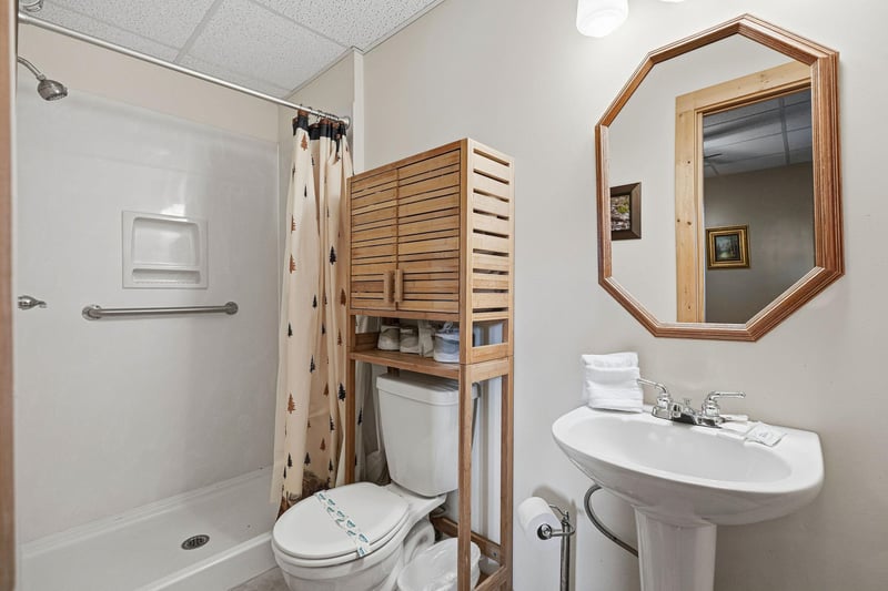 Your private bathroom features a spacious walkin shower, convenient storage, and all essentials for a comfortable stay.