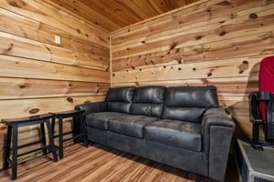 Sink into the plush leather sofa and unwind in your private cedarlined retreat—your perfect spot to relax after a day of adventure.