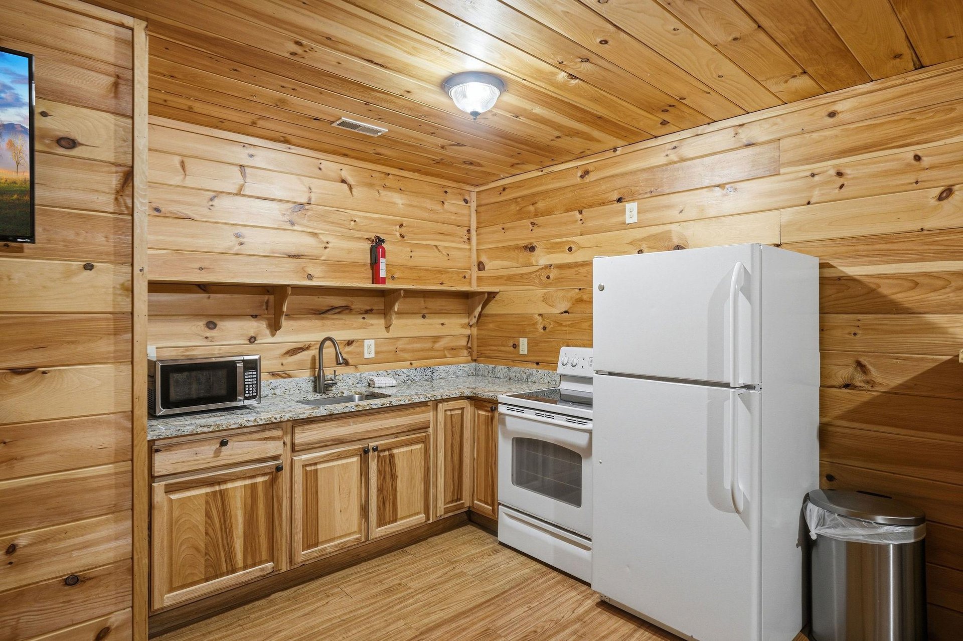 Your rustic log cabin kitchen features granite counters, full appliances, and microwave for easy meal prep.