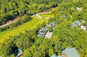 A private mountain retreat nestled among lush forest and meadows, offering complete seclusion and natural beauty in every direction.