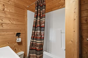 Step into your private bathroom with rustic wood accents and a cozy Southwestinspired shower curtain. Fresh towels and thoughtful touches await to make you feel right at home.