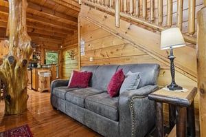 Settle into this plush sofa and take in the cabins rustic charm. The warm wood tones, handcrafted furniture, and welcoming touches create a cozy retreat where you can truly unwind.