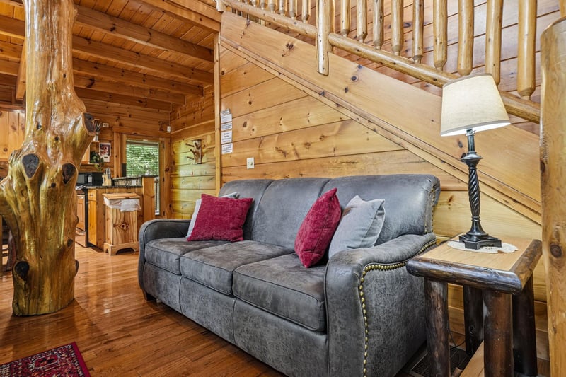 Settle into this plush sofa and take in the cabins rustic charm. The warm wood tones, handcrafted furniture, and welcoming touches create a cozy retreat where you can truly unwind.