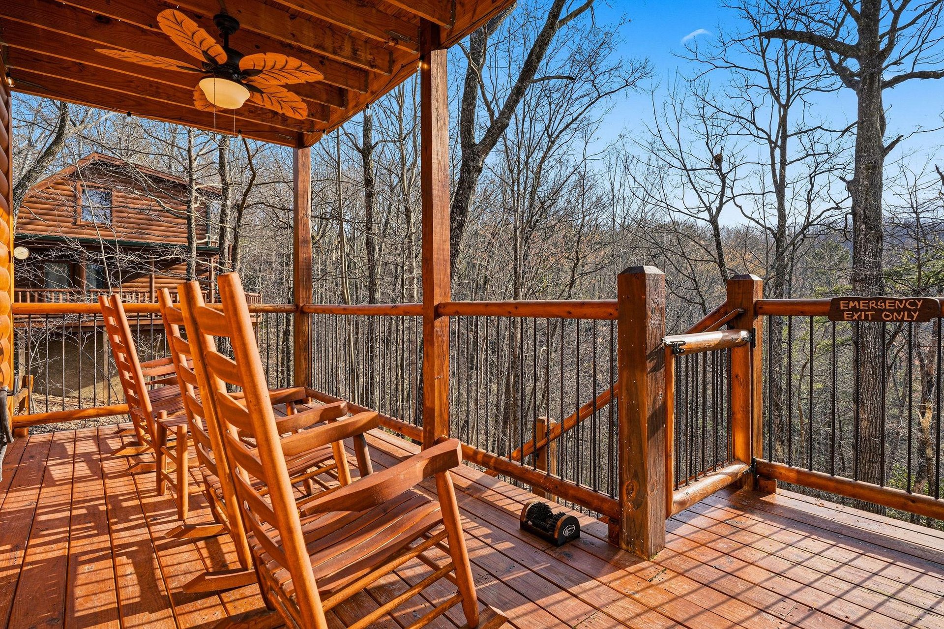 Relax in rustic wooden rockers on your private deck, surrounded by peaceful forest views and fresh mountain air.
