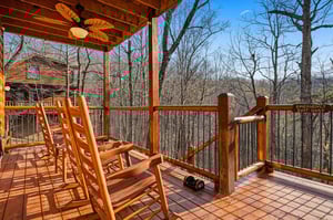 Relax in rustic wooden rockers on your private deck, surrounded by peaceful forest views and fresh mountain air.