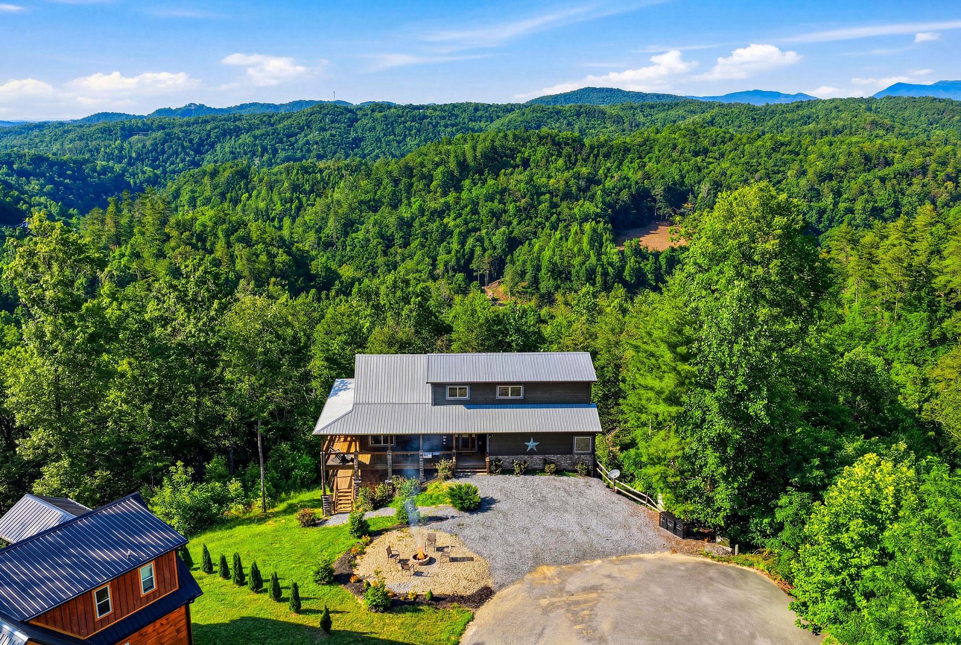 A private mountain retreat nestled in lush forested hills offers peaceful seclusion and breathtaking scenery in all directions.