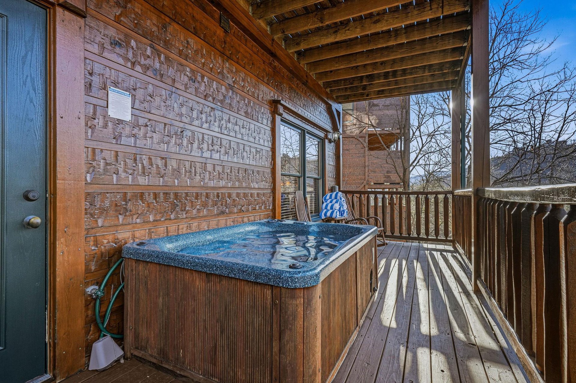 Relax in your private hot tub on the covered deck, where woodbeamed ceilings and peaceful treelined views create the perfect outdoor retreat any time of day.