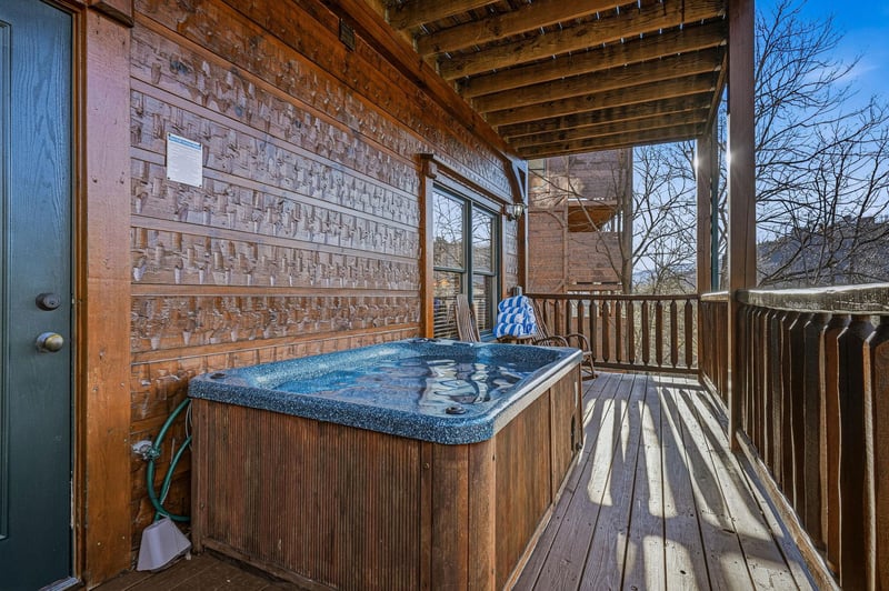 Relax in your private hot tub on the covered deck, where woodbeamed ceilings and peaceful treelined views create the perfect outdoor retreat any time of day.