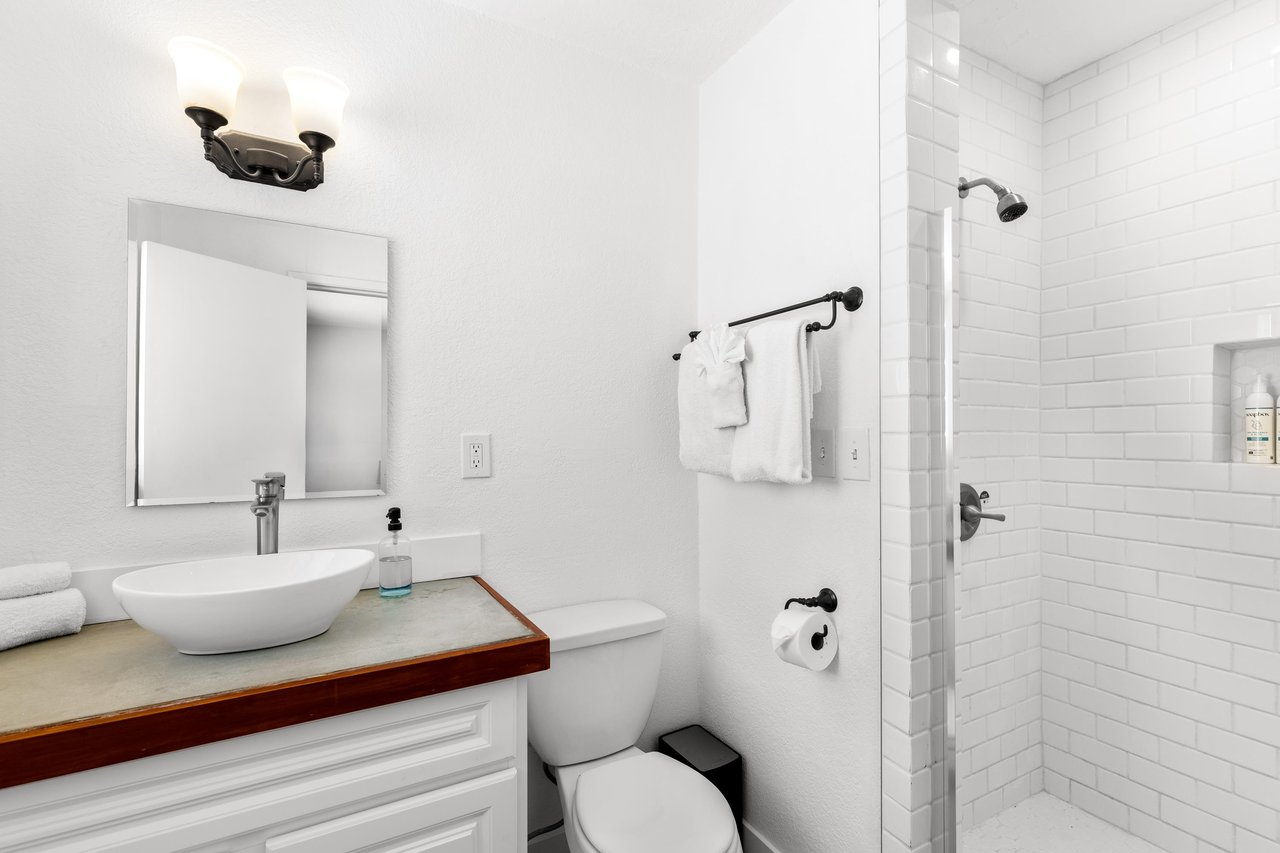 Guest bathroom with stand alone shower.
