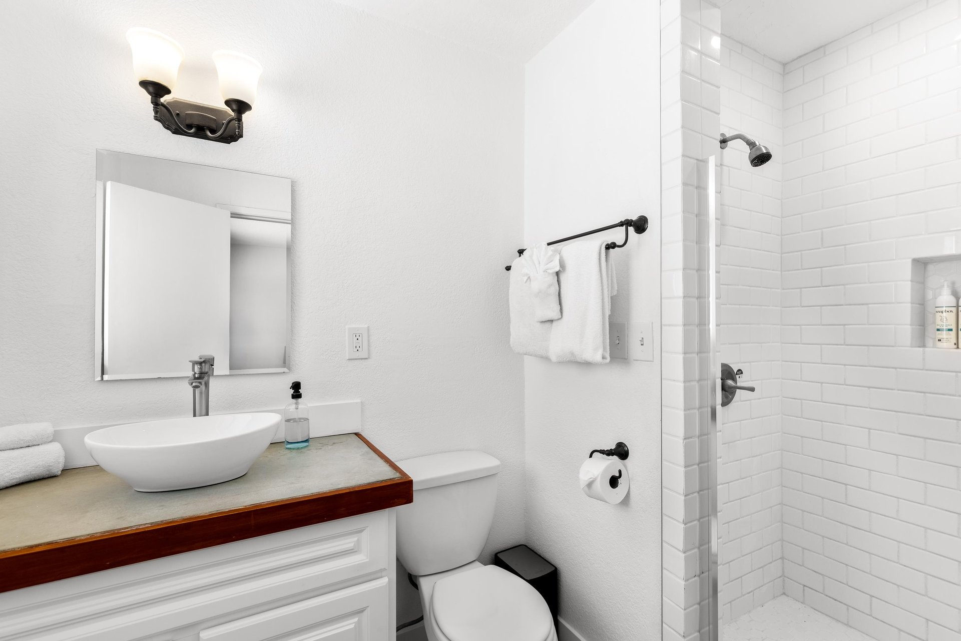 Guest bathroom with stand alone shower.