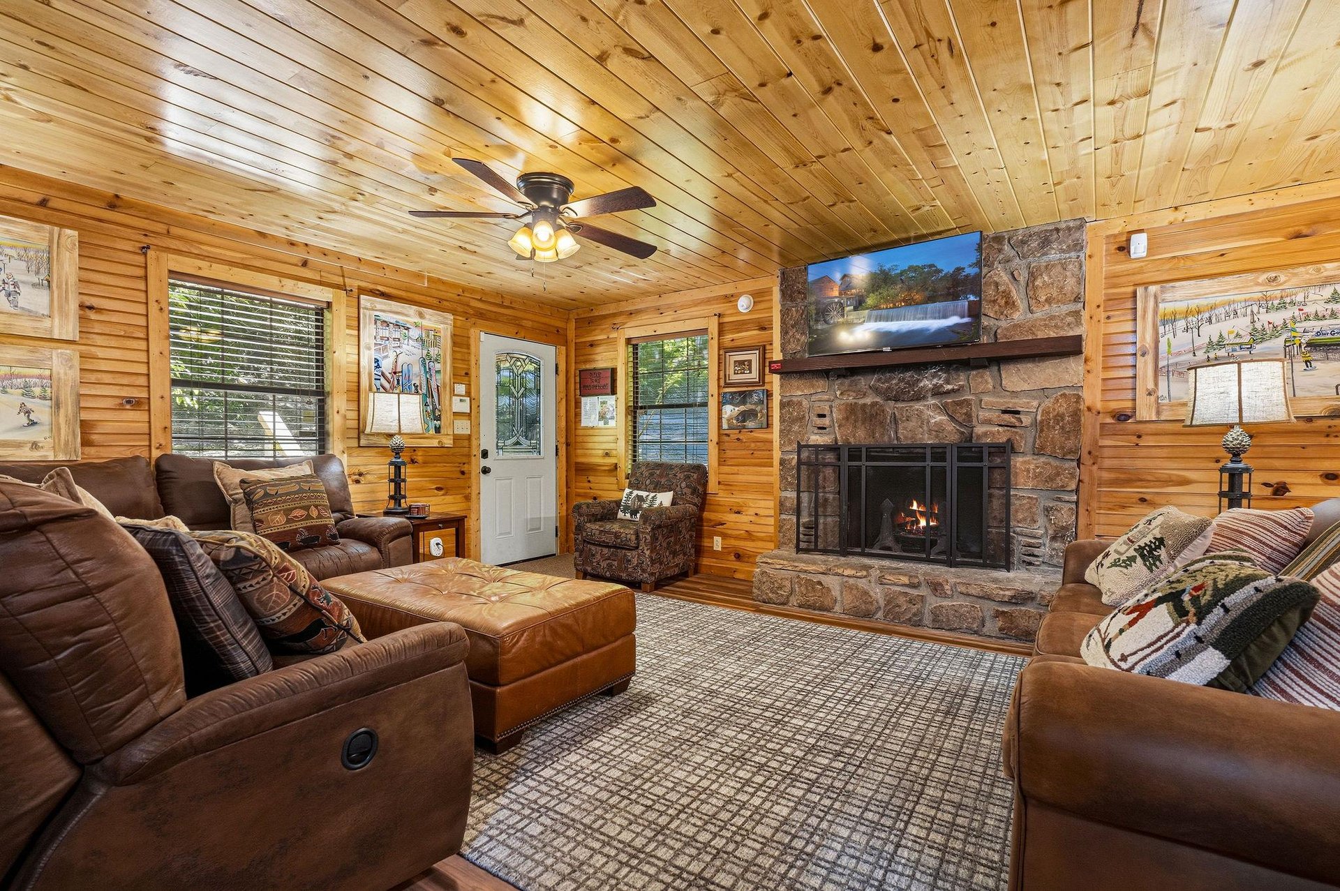 Sink into plush leather seating around the stone fireplace, where warm wood surrounds you and your favorite shows await on the big screen.