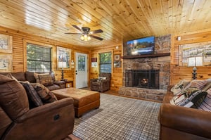 Sink into plush leather seating around the stone fireplace, where warm wood surrounds you and your favorite shows await on the big screen.