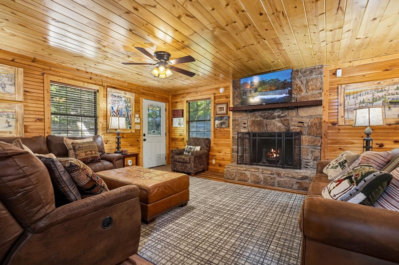 Sink into plush leather seating around the stone fireplace, where warm wood surrounds you and your favorite shows await on the big screen.