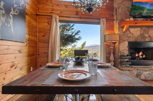 Dining table for eight at Mountain Mama, a 3 bedroom cabin rental located in Pigeon Forge