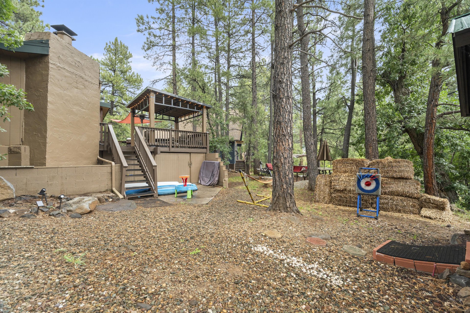 Outdoor space off of the deck with outdoor games.