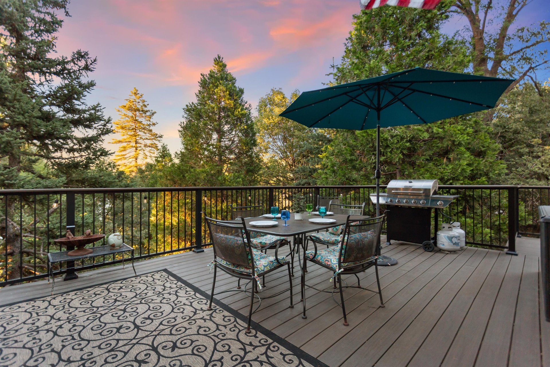 Wrap around deck with dining, lounge chairs, and BBQ.