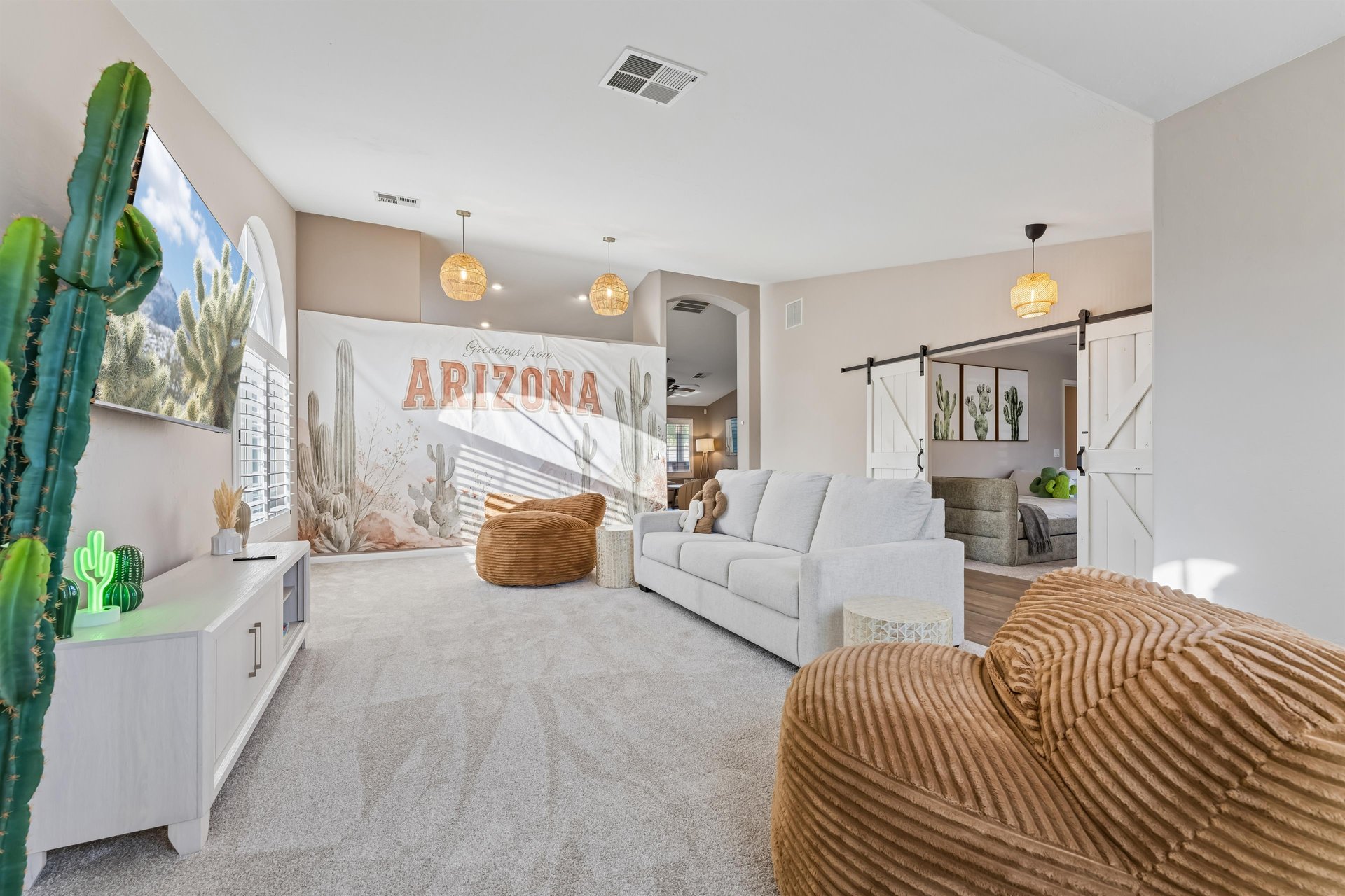 Additional living room with flatscreen TV and cozy seating perfect for movie nights