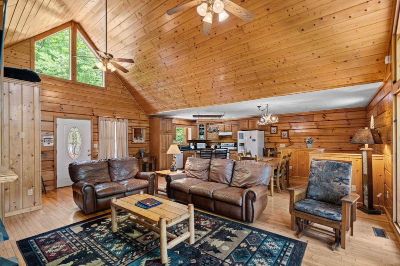Living room with dining and kitchen attached at Wildlife Retreat, a 3 bedroom cabin rental located in Pigeon Forge