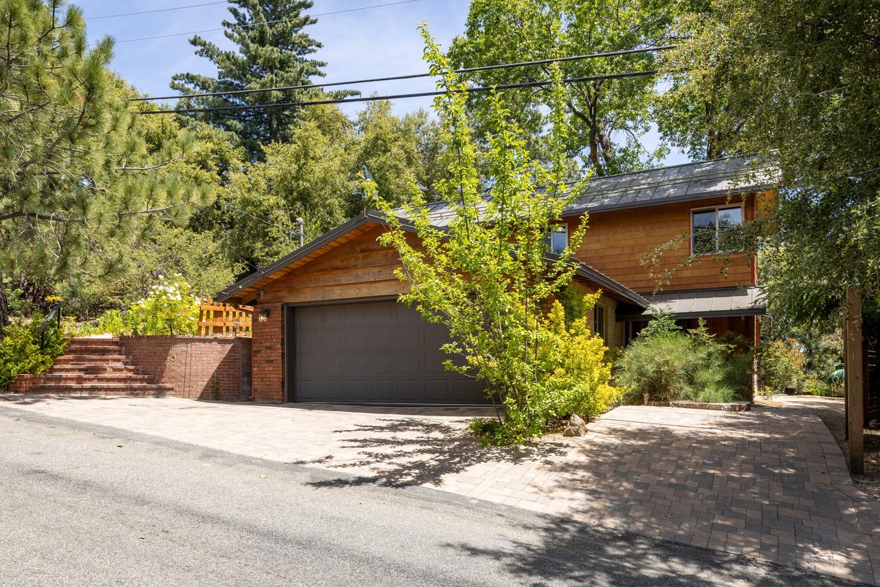 Two car garage with additional outdoor parking and separate entrance to
downstairs bedroom.