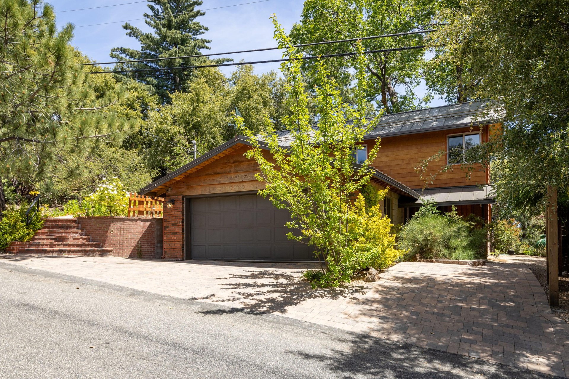 Two car garage with additional outdoor parking and separate entrance to
downstairs bedroom.