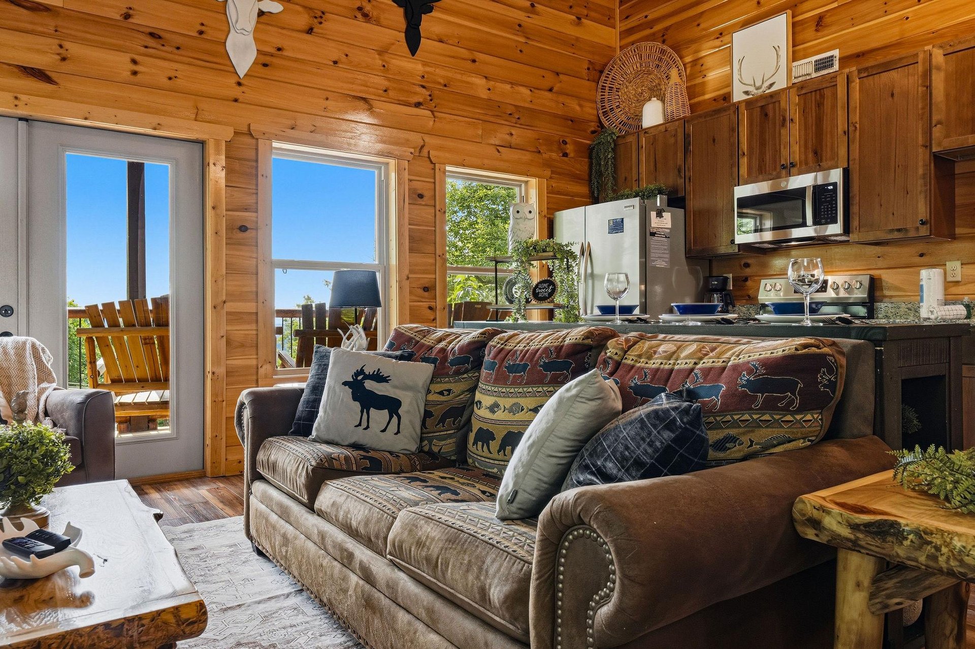 Step into this cozy cabin where rustic pine walls and charming wildlife accents invite you to unwind. Your open living space flows to a deck, perfect for morning coffee with natures backdrop.