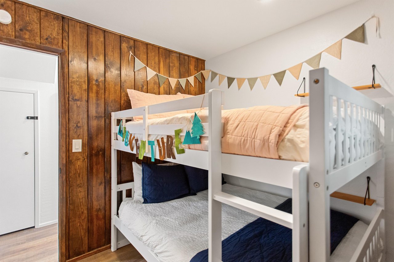 Full over full bunk beds located on the lower level.