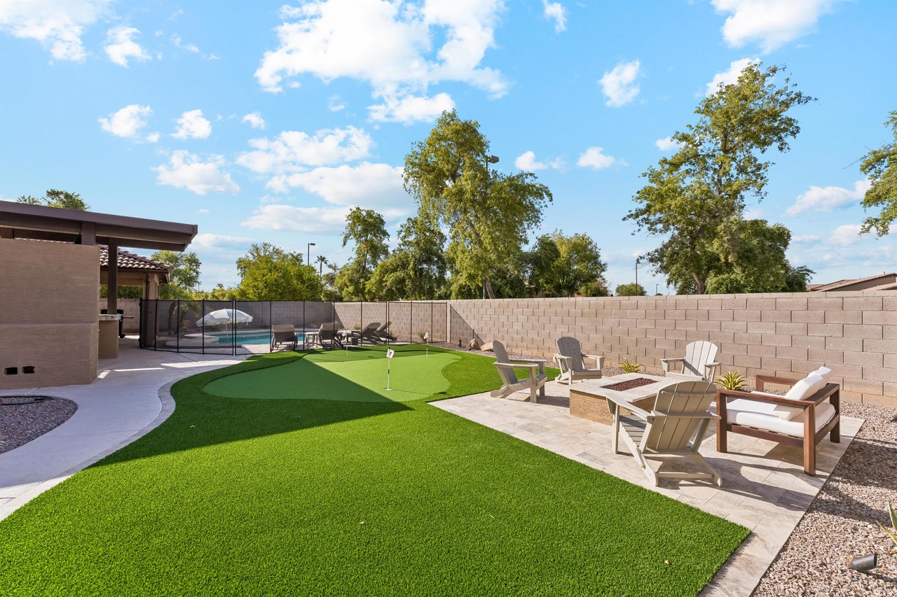 Private putting green next to the patio and pool area.