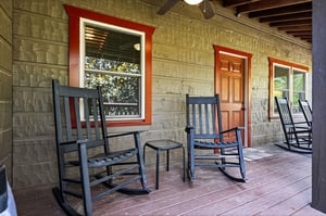 Picture yourself rocking gently in a chair on this peaceful porch, savoring morning coffee or watching the day wind down in total tranquility.