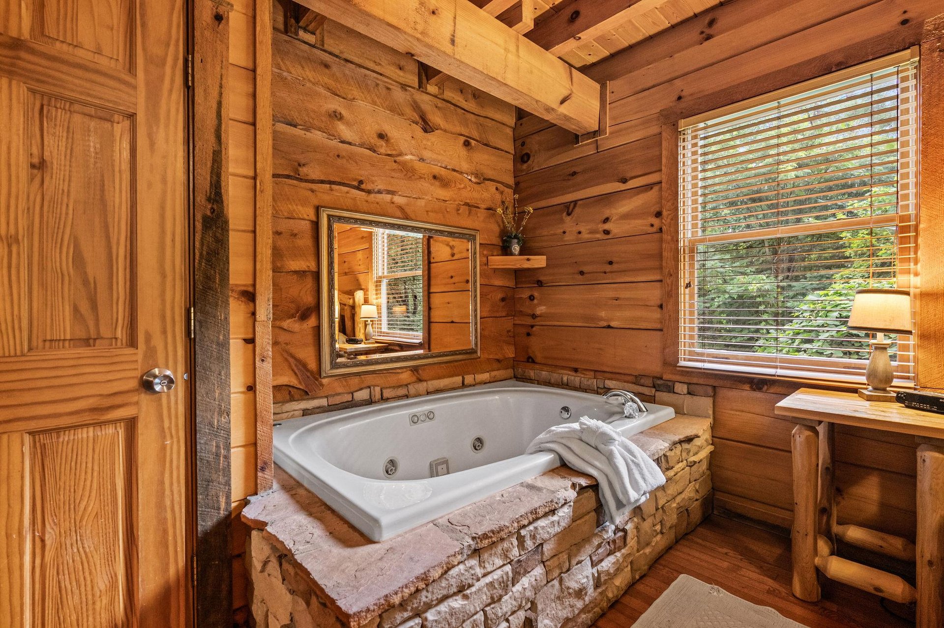 Unwind in your private jetted tub surrounded by warm log walls and forest views streaming through your window.