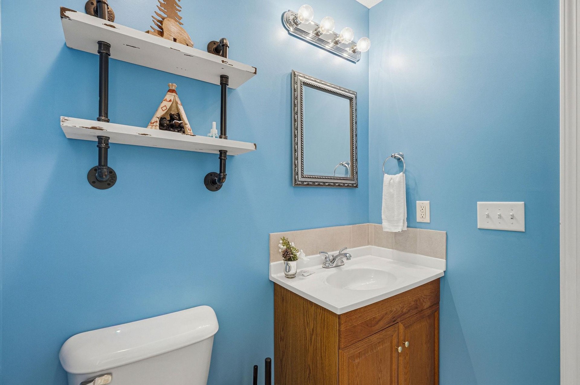 Freshen up in your bright bathroom with industrialstyle shelving and thoughtful touches that make your stay feel like home.